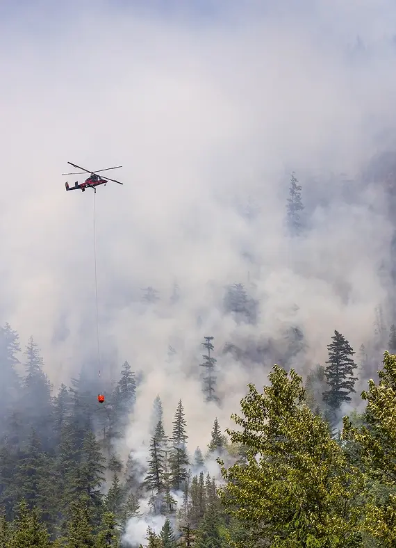 helicopter-battling-forest-fire-amid-dense-smoke-i-2026-03-25-09-14-05-utc 1